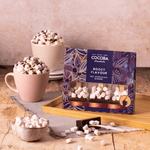 Boozy Flavoured Hot Chocolate Spoon Set (3 spoons) with two hot chocolates on a wooden tray.
