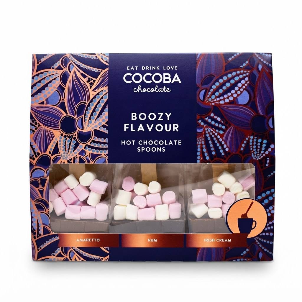Cocoba Chocolate Boozy Flavour Hot Chocolate Spoons in a dark blue patterned box with a clear window showing pink and white marshmallows, on a white background.