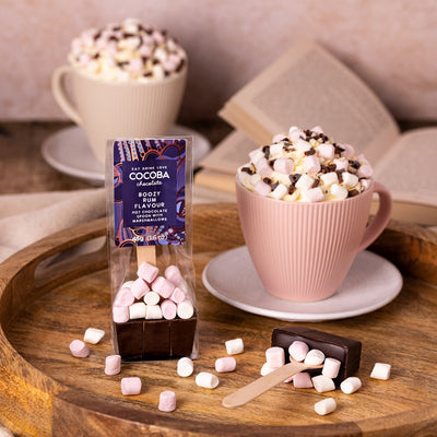 COCOBA Rum flavoured dark chocolate hot chocolate spoon with marshmallows and rum flavor on a wooden tray.