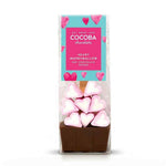 A packaged chocolate hot chocolate spoon set in a clear bag, featuring a pink and teal label that reads 'Fat Chum Love COCOBA chocolate' and 'Heart Marshmallow Hot Chocolate Spoon.' The spoon base is dark brown chocolate, with several pink-and-white heart-shaped marshmallows stacked on top.