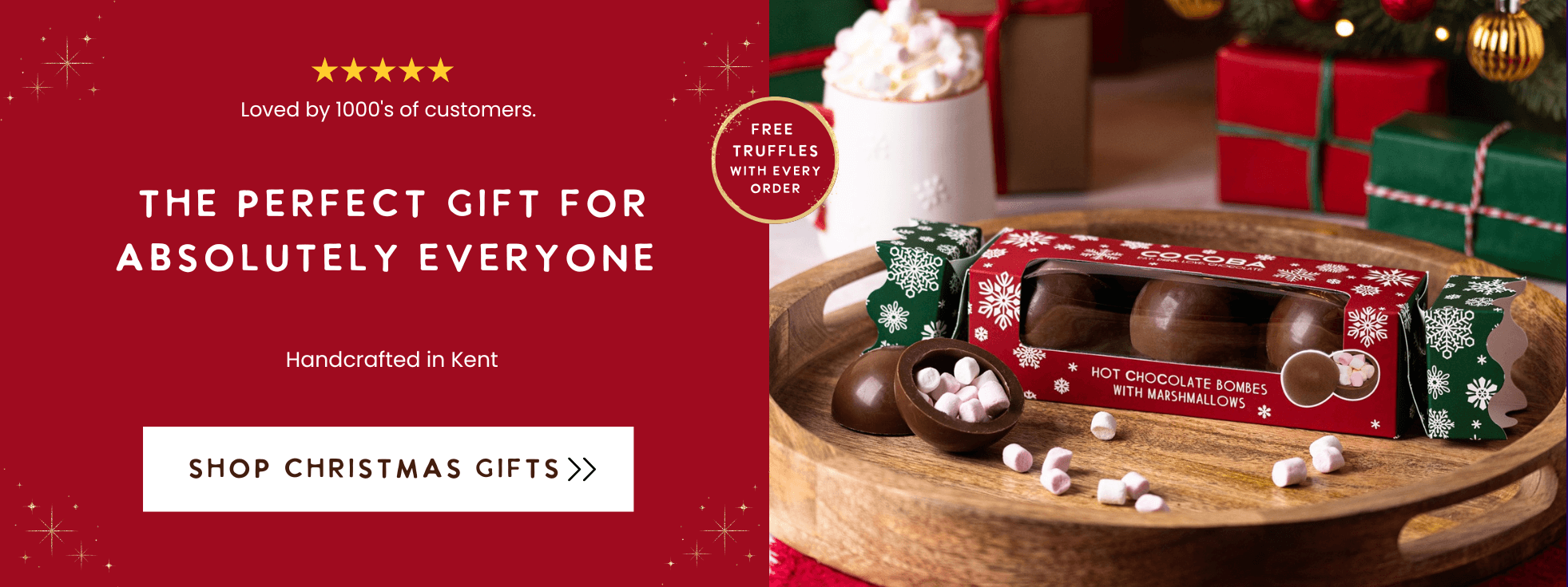 Hot chocolate bomb gift set with truffles on a wooden tray, Christmas-themed packaging, and promotional text on a red background.
