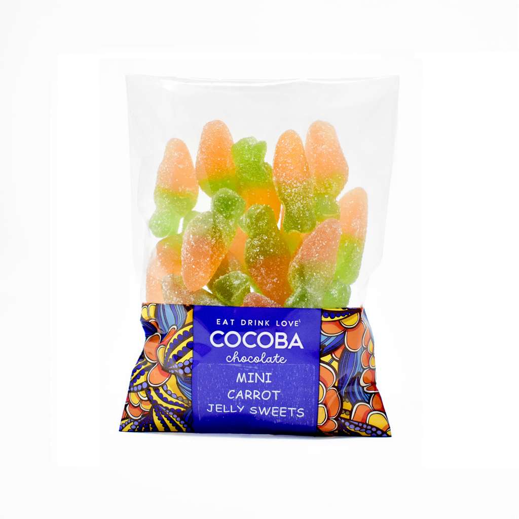 A clear plastic bag of Cocoba Chocolate Mini Carrot Jelly Sweets, showing the orange and green gummy carrots inside, with a blue and patterned wrapper at the bottom on a white background.