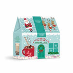 Cocoa Brothers 6 Hot Chocolate Sharing Pack in a festive light blue and teal gift box with illustrations of Santa Claus, reindeer, a red mug, and holiday decorations.