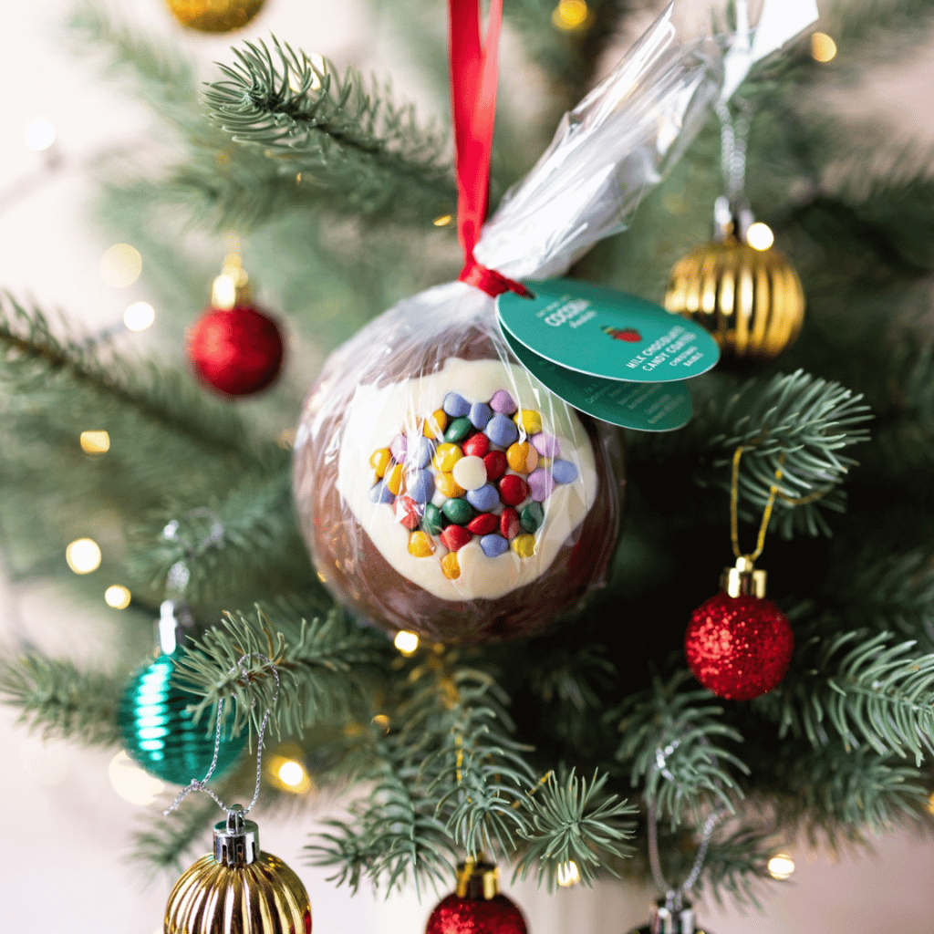 Candy Bean Milk and White Chocolate Christmas Bauble on a Christmas Tree