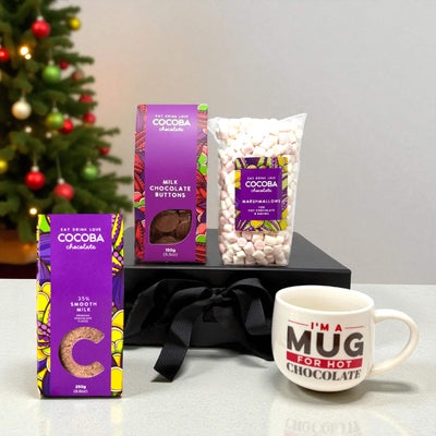 Indulgent gift set on a christmas themed background