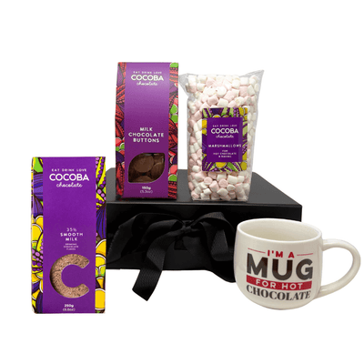 Chocolate Indulgence Gift Set product shot, includes Milk Flakes, Milk Buttons, a bag of marshmallows, a cocoba mucg and a gift box