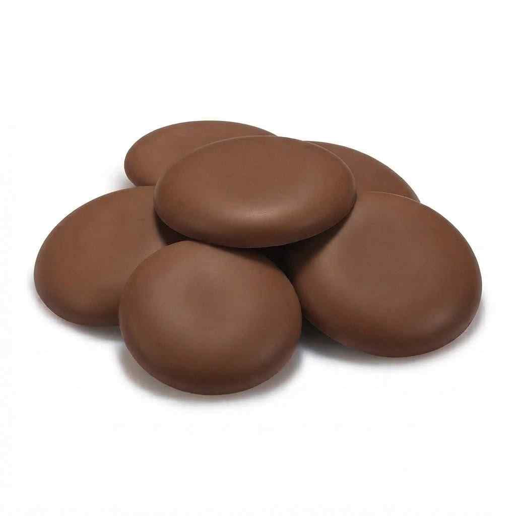 Six smooth, oval chocolate buttons arranged in a small pile on a clean white background.