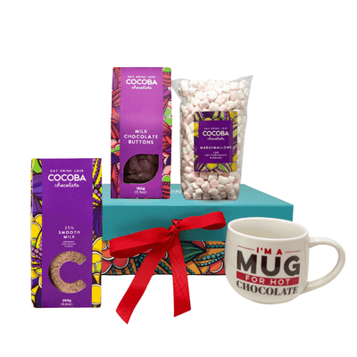 Chocolate Indulgence Gift Set product shot, includes Milk Flakes, Milk Buttons, a bag of marshmallows, a cocoba mucg and a gift box
