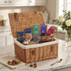 Wicker gift basket with cocoba chocolate snacks on a kitchen counter