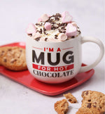 A Cocoba Hot Chocolate Mug with a hot chocolate, and cookies