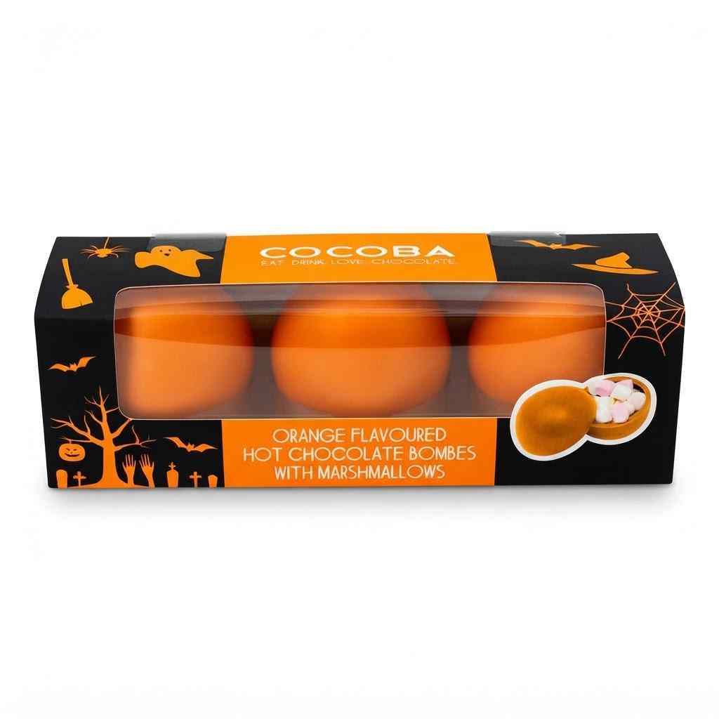 Cocoba Halloween themed packaging containing three orange hot chocolate bombs with marshmallows, shown on a white background.