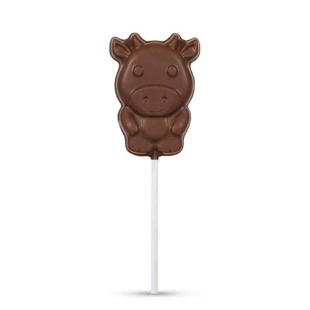 A milk chocolate cow-shaped lollipop on a white stick, centered against a plain white background.