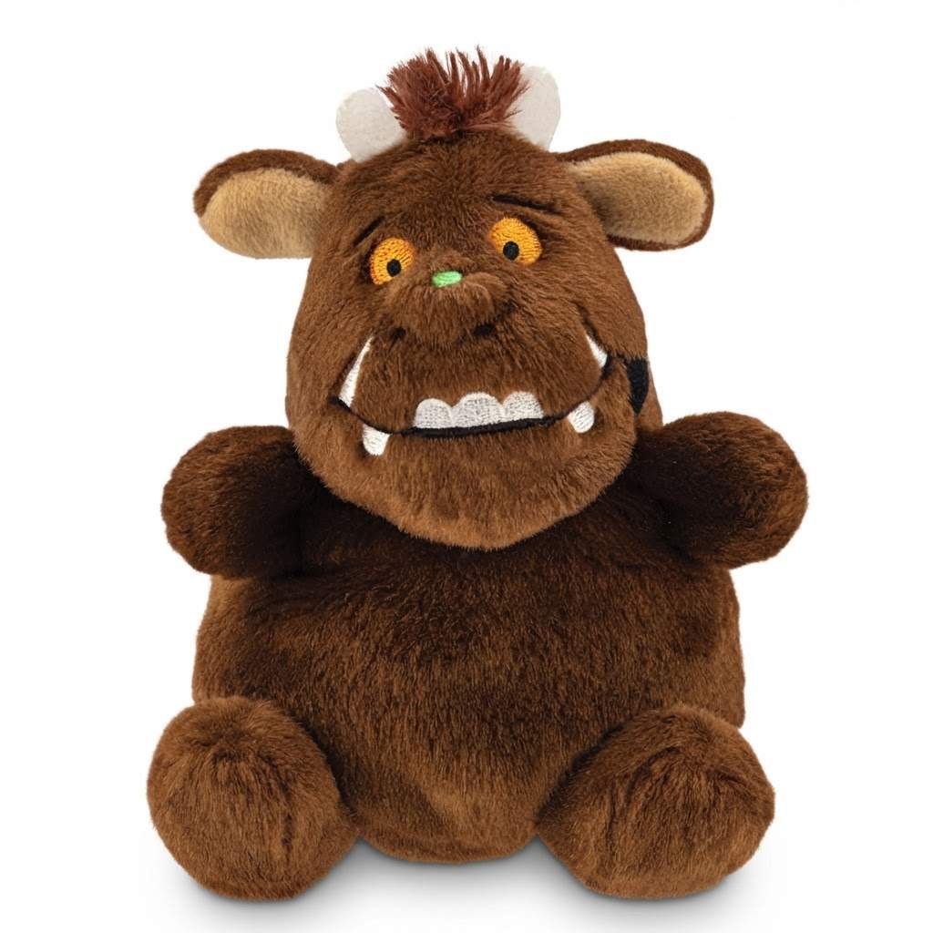 A brown plush Gruffalo toy with large ears, yellow eyes, a small green nose, and white tusks, photographed on a plain white background.