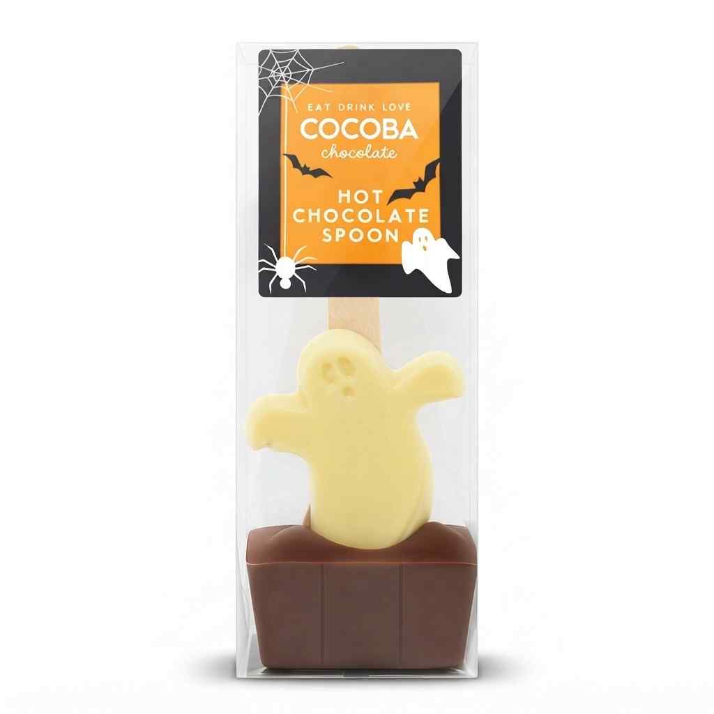 A packaged Halloween-themed chocolate hot spoon. The product is shown inside a clear plastic clamshell package with a cardboard header card.