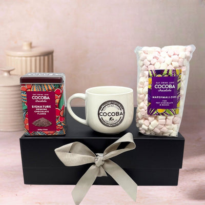 Chocolate drinking flakes, Cocoba mug and a bag of marshmallows