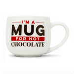 A white ceramic mug with a bold printed slogan reading 'I'M A MUG FOR HOT CHOCOLATE' in black and red lettering, shown on a clean white background.