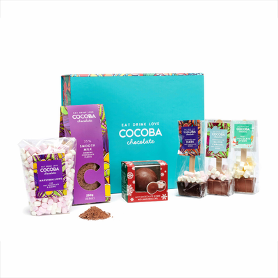 Cocoba chocolate products including a box, packets, and bags on a white background