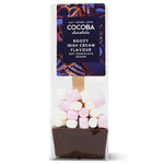 Cocoa Chocolate Boozy Irish Cream Flavour Hot Chocolate Spoon in a clear plastic bag with a dark purple label, containing a brown chocolate base topped with pink and white marshmallows.