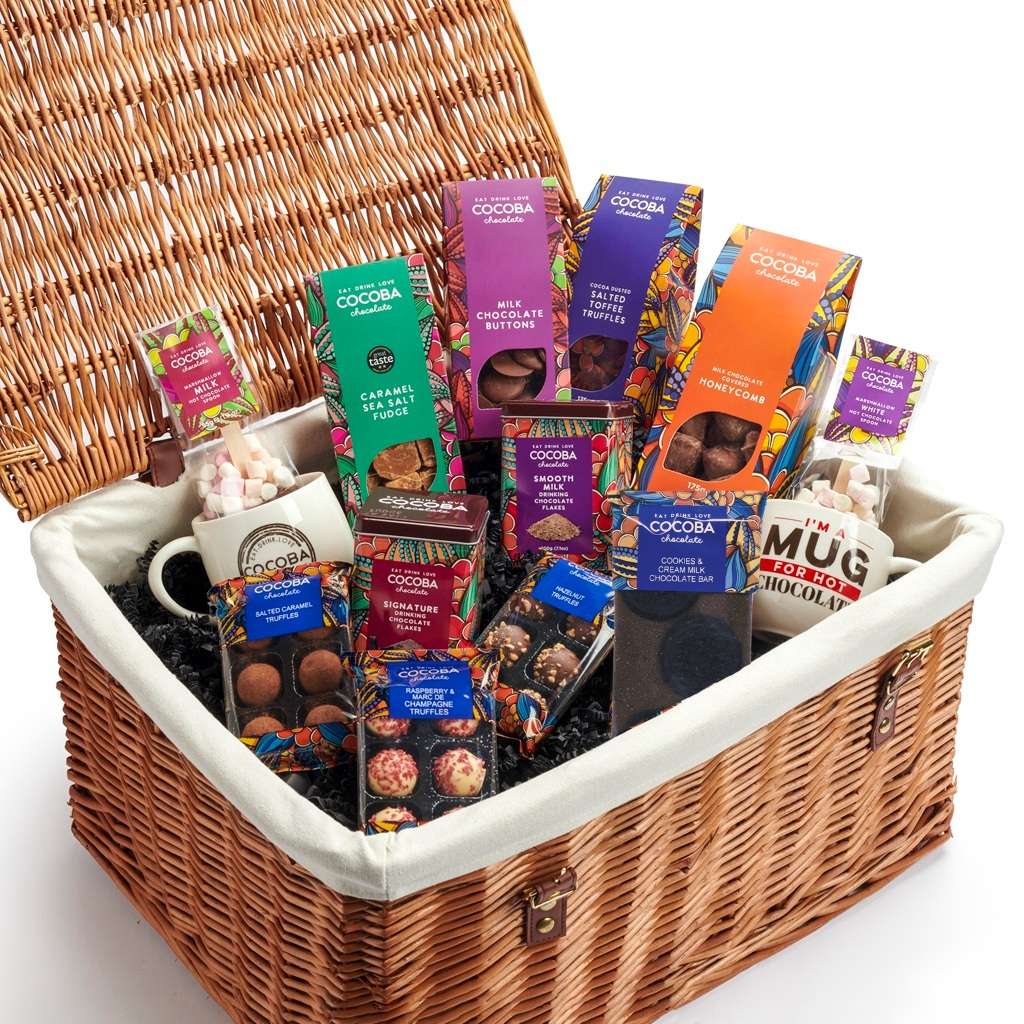 Luxury Wicker Hamper filled with Cocoba chocolate treats including truffles, buttons, a chocolate bar, hot chocolate flakes and spoons and 2 Cocoba Hot Chocolate Mugs.