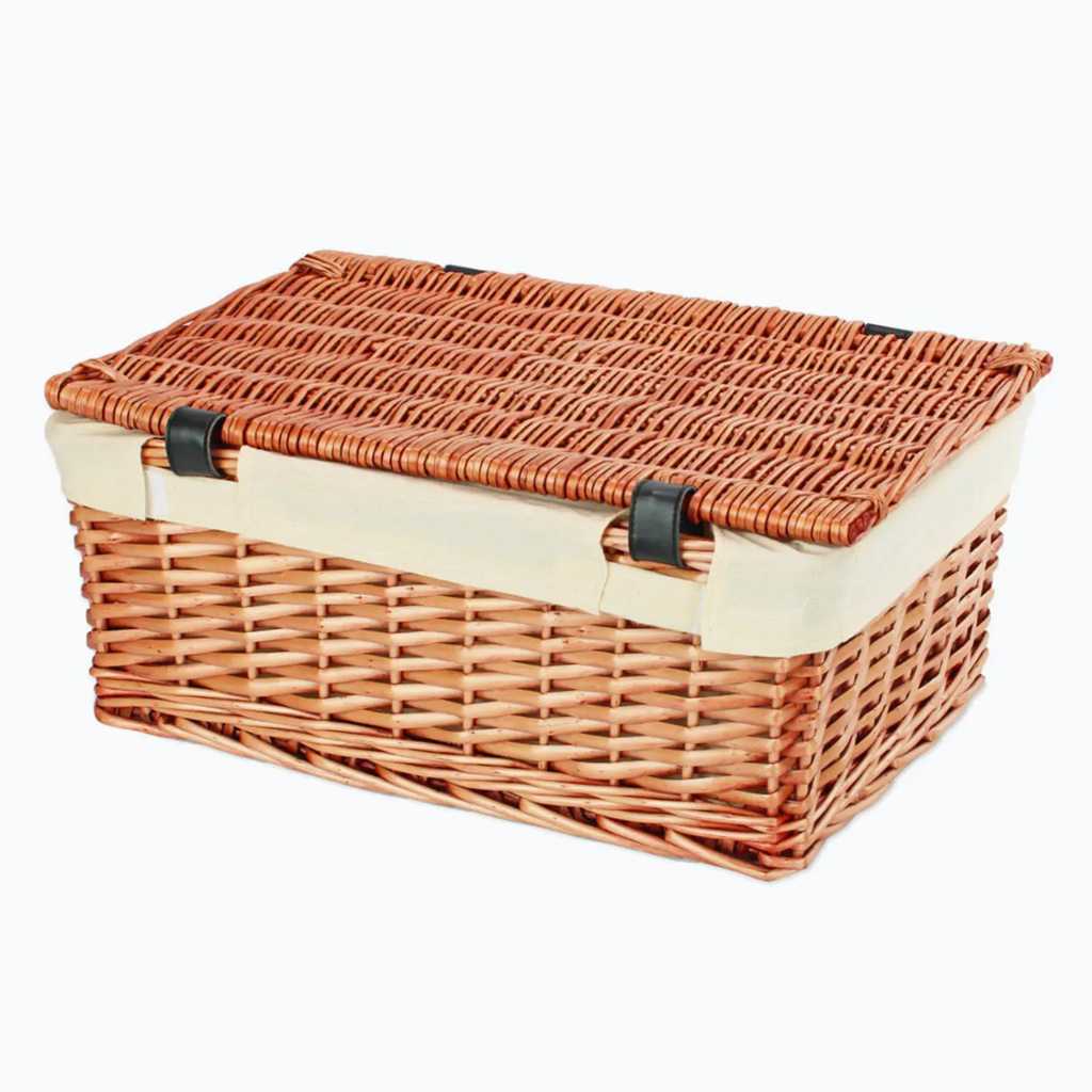 16 inch Wicker Hamper made from Split Willow, with a white cotton liner and two faux leather black buckles for fastening.