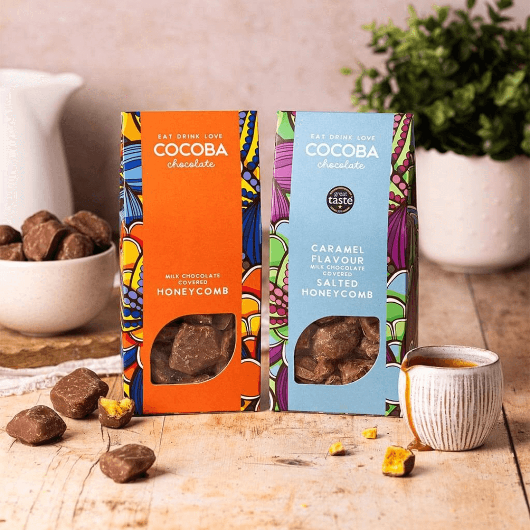 Milk Chocolate Covered Honeycomb and Caramel Flavour Milk Chocolate Covered Salted Honeycomb on a wooden board with Milk Chocolate Covered Honeycomb and  Salted Honeycomb around. 