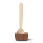 A wooden spoon with a light natural wood handle and bowl, set in a square brown holder on a plain white background.
