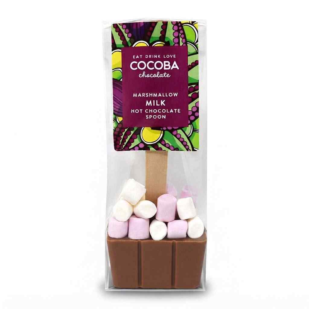 A packaged chocolate hot spoon treat from Cocoa Chocolate, featuring a brown milk chocolate base topped with pink and white marshmallows inside a clear bag with a colorful label.
