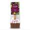 A packaged chocolate hot spoon treat from Cocoa Chocolate, featuring a brown milk chocolate base topped with pink and white marshmallows inside a clear bag with a colorful label.