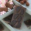 Milk Chocolate Bar with Oreo cookies surrounded by Cocoba chocolate and marshmallows.