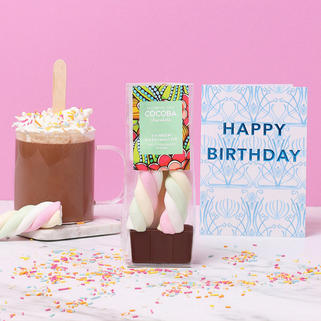Rainbow Hot Chocolate Stirrer with hot chocolate and sprikles and a Happy Birthday card