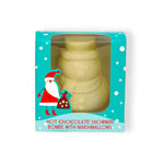 A packaged novelty hot chocolate bomb shaped like a snowman, shown inside a turquoise gift box with white polka dots and a Santa Claus illustration. The text on the box reads 'HOT CHOCOLATE SNOWMAN BOMBE WITH MARSHMALLOWS.