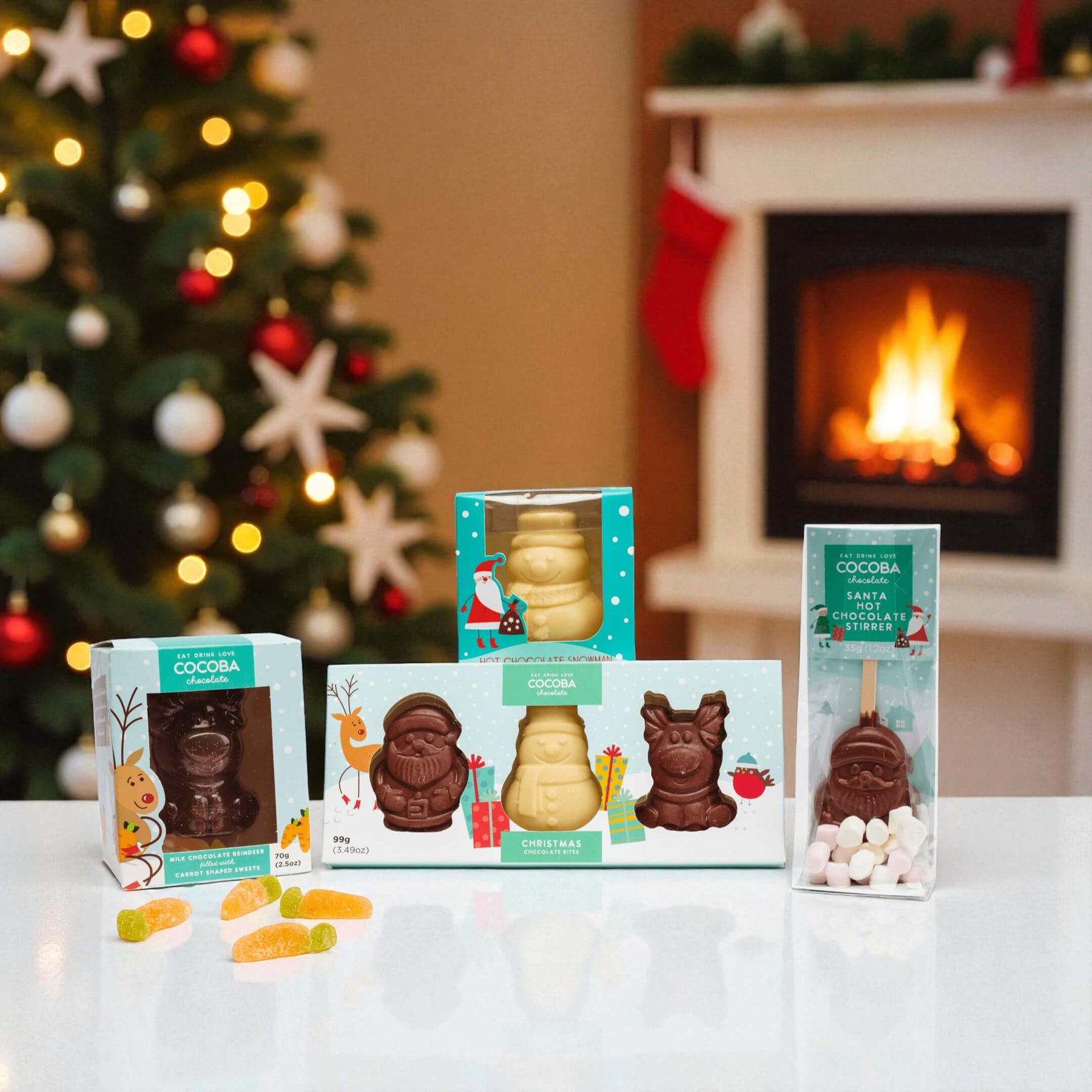 stocking filler bundle with a christmas tree, fire and christmas stocking in the background