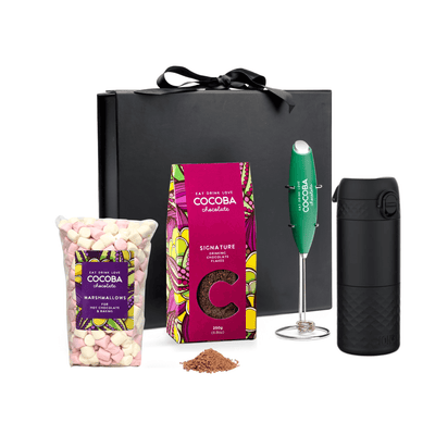 Cocoba chocolate products, including a black gift box, Hot chocolate products, marshmallows, and a frother on a white background.