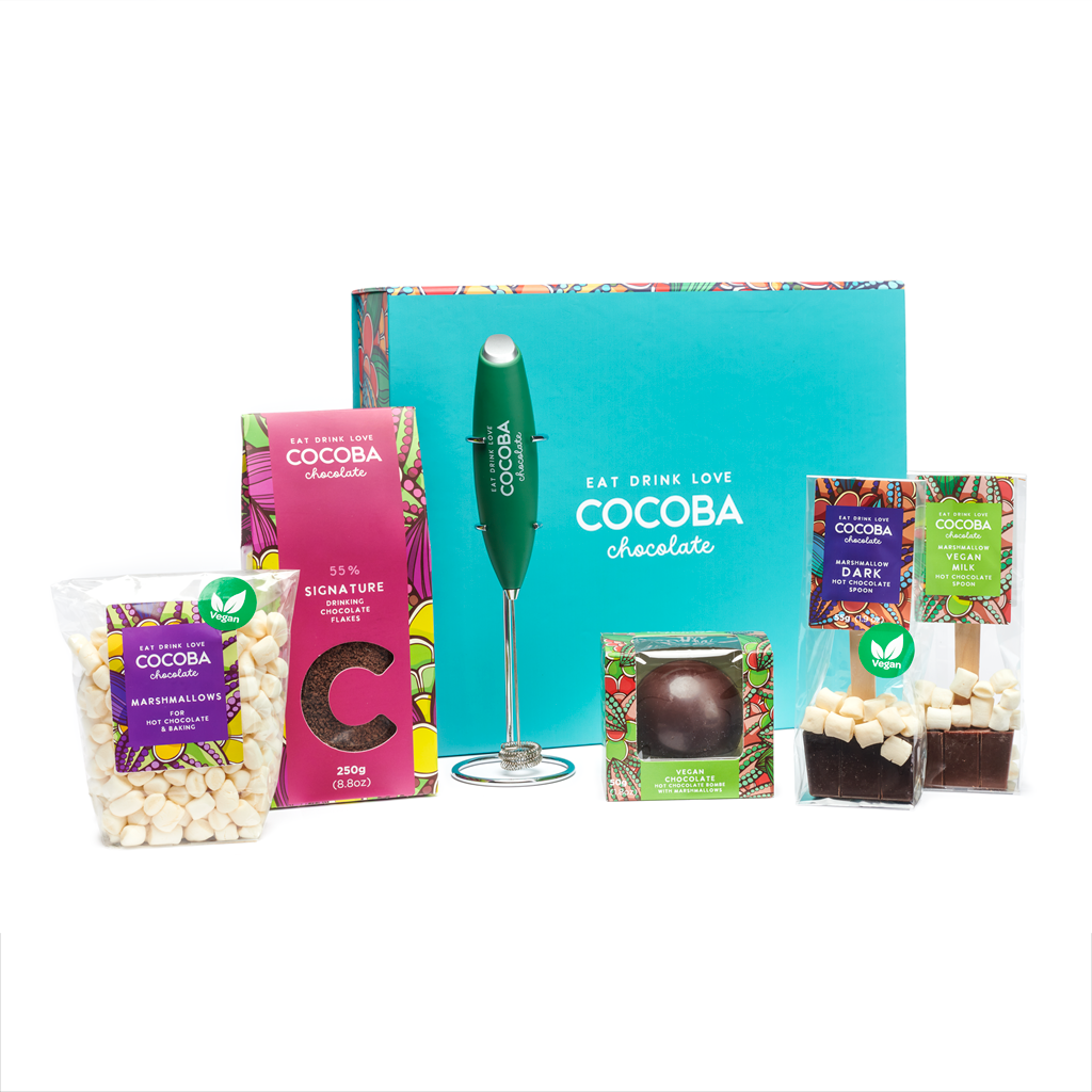 55% Dark hot chocolate flakes, 
a vegan hot chocolate bombe, and two vegan chocolate hot chocolate spoons, with vegan marshmallows, plus a hot chocolate frother and a beautiful Cocoba gift box