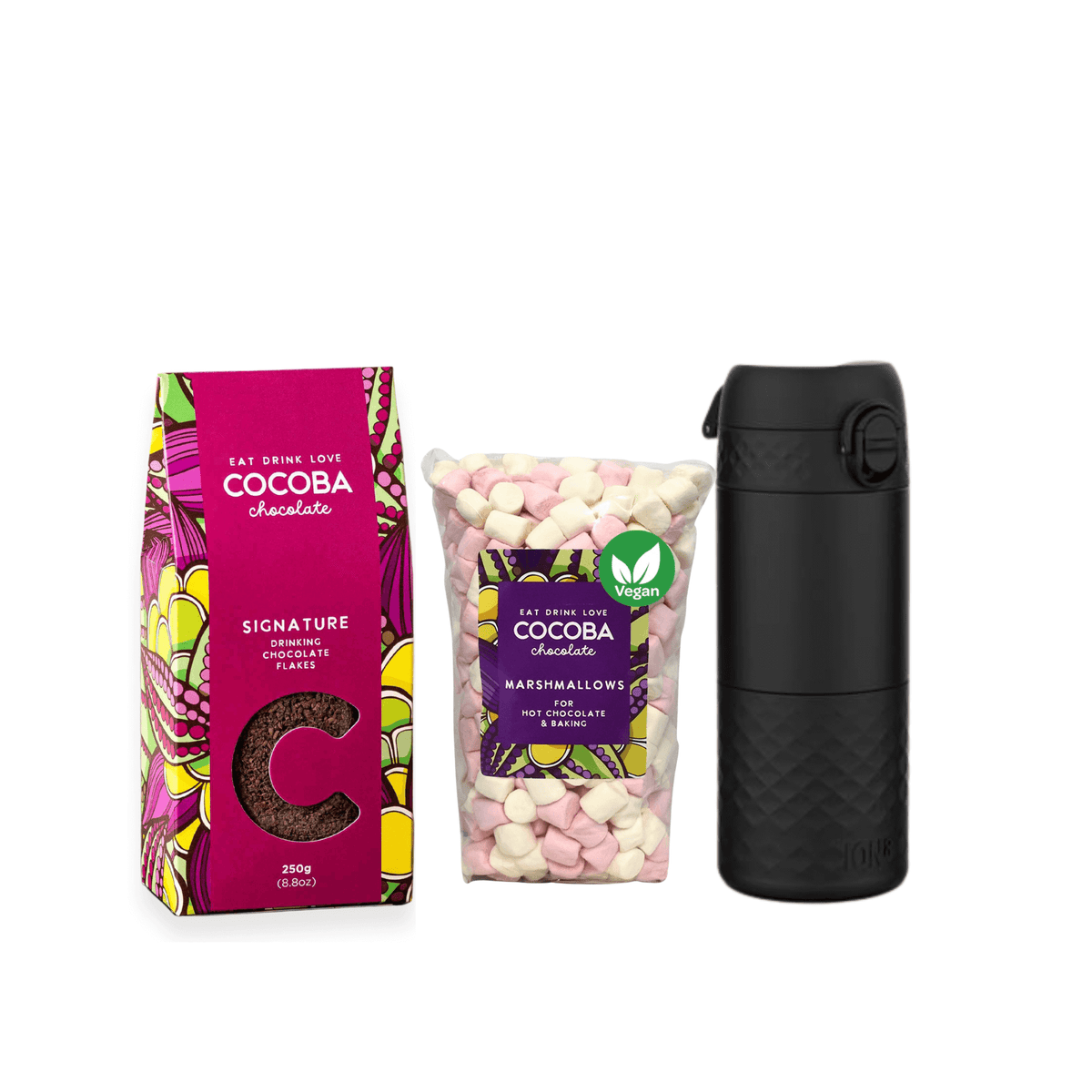 Signature Hot Chocolate Flakes, vegan marshmallows and a travel mug on a white background