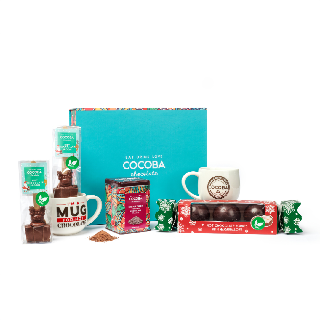 Cocoba chocolate products including a mug, boxes, and packets on a white background