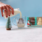 Christmas character hot chocolate bombes with the Santa bombe Melting in a mug 